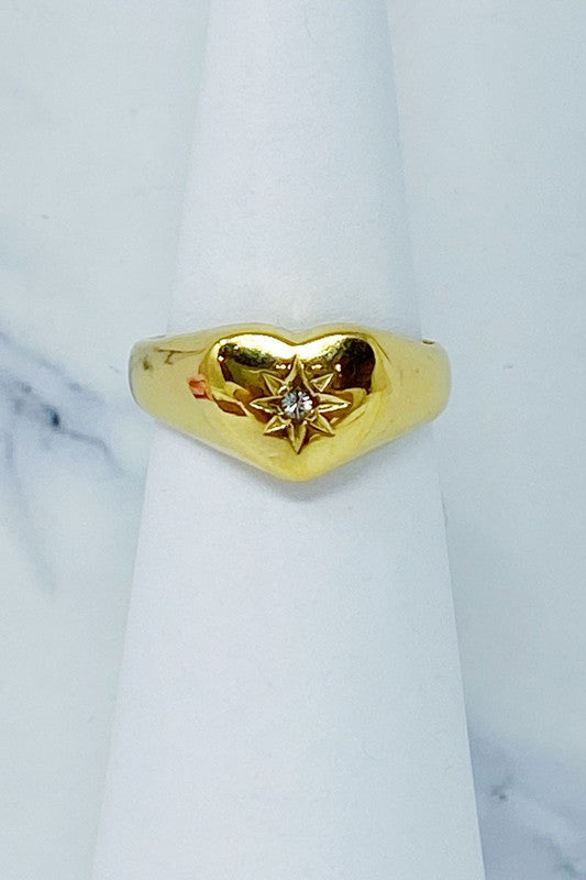 Anillo tipo sello con forma de corazón y rayos de sol